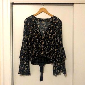 Free people ditsy bodysuit in size XS. Mix of black, green, blue, & pale yellow